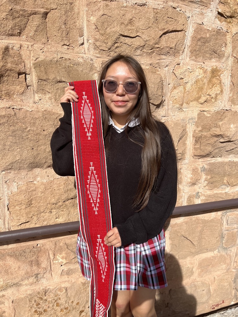 student who made a sash belt for art show