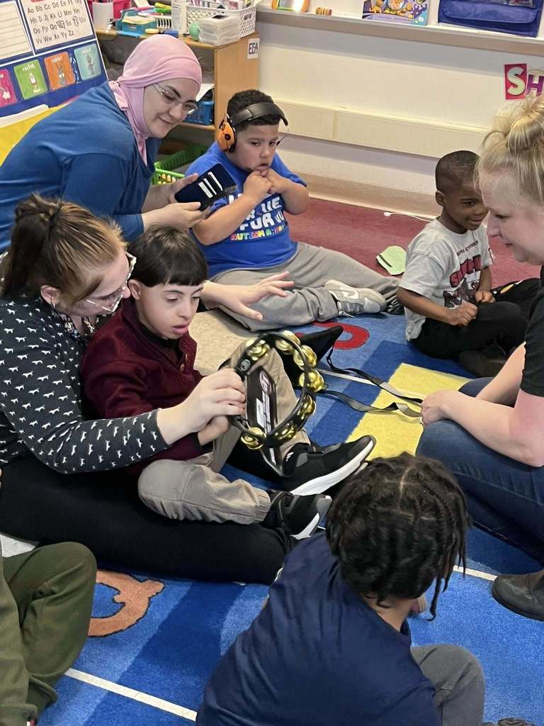 Students playing instruments in a classroom. 