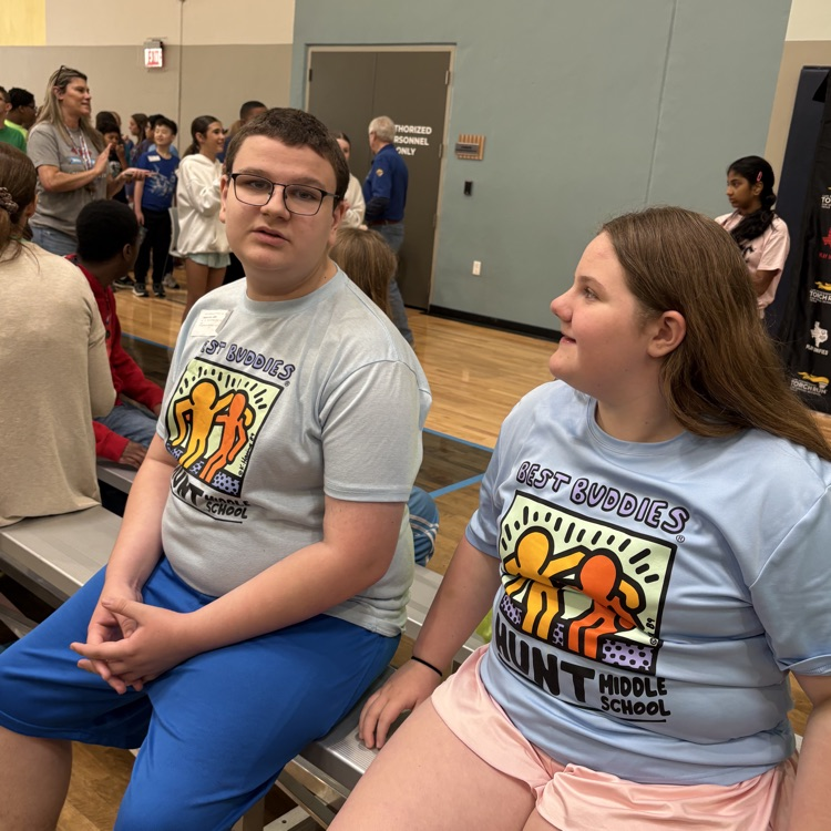 students on bench at special Olympics