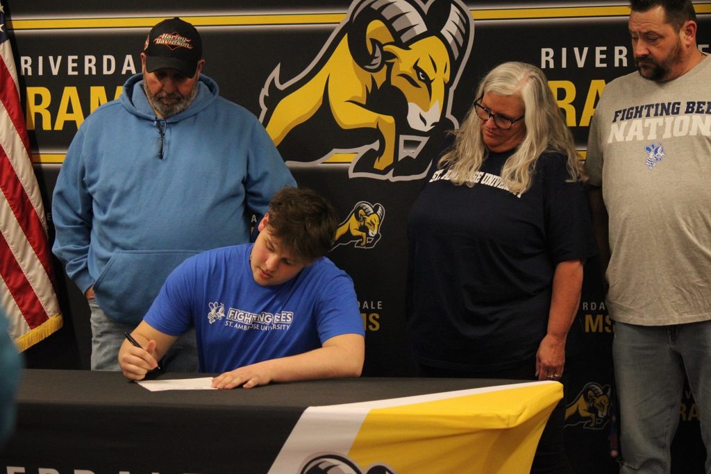 Students signing for college athletics
