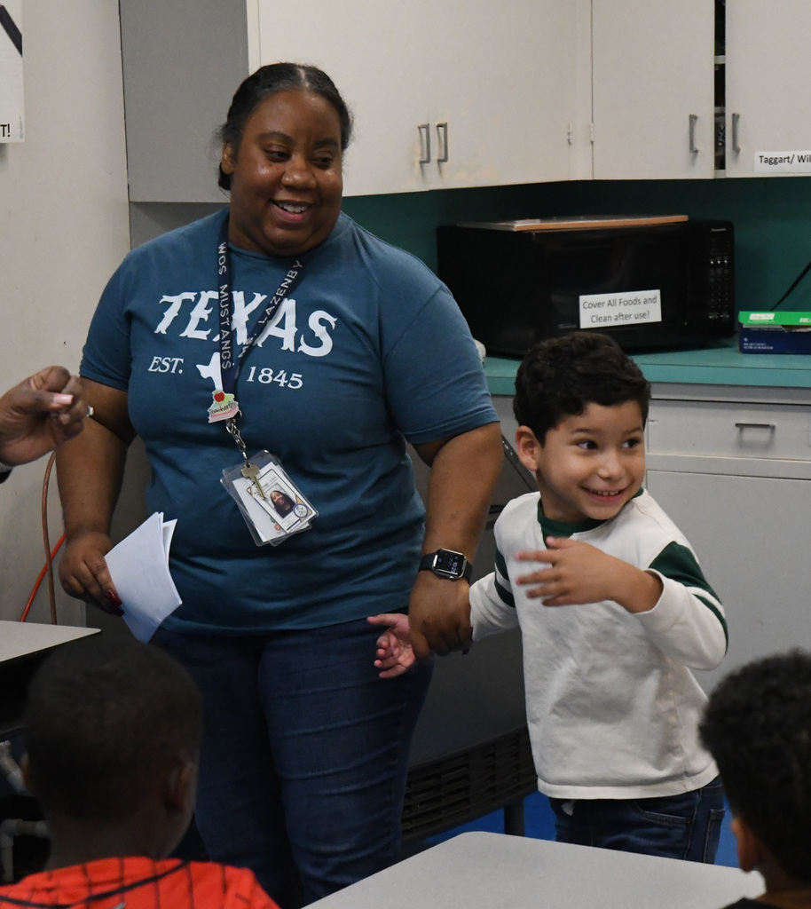 teacher and child smiling
