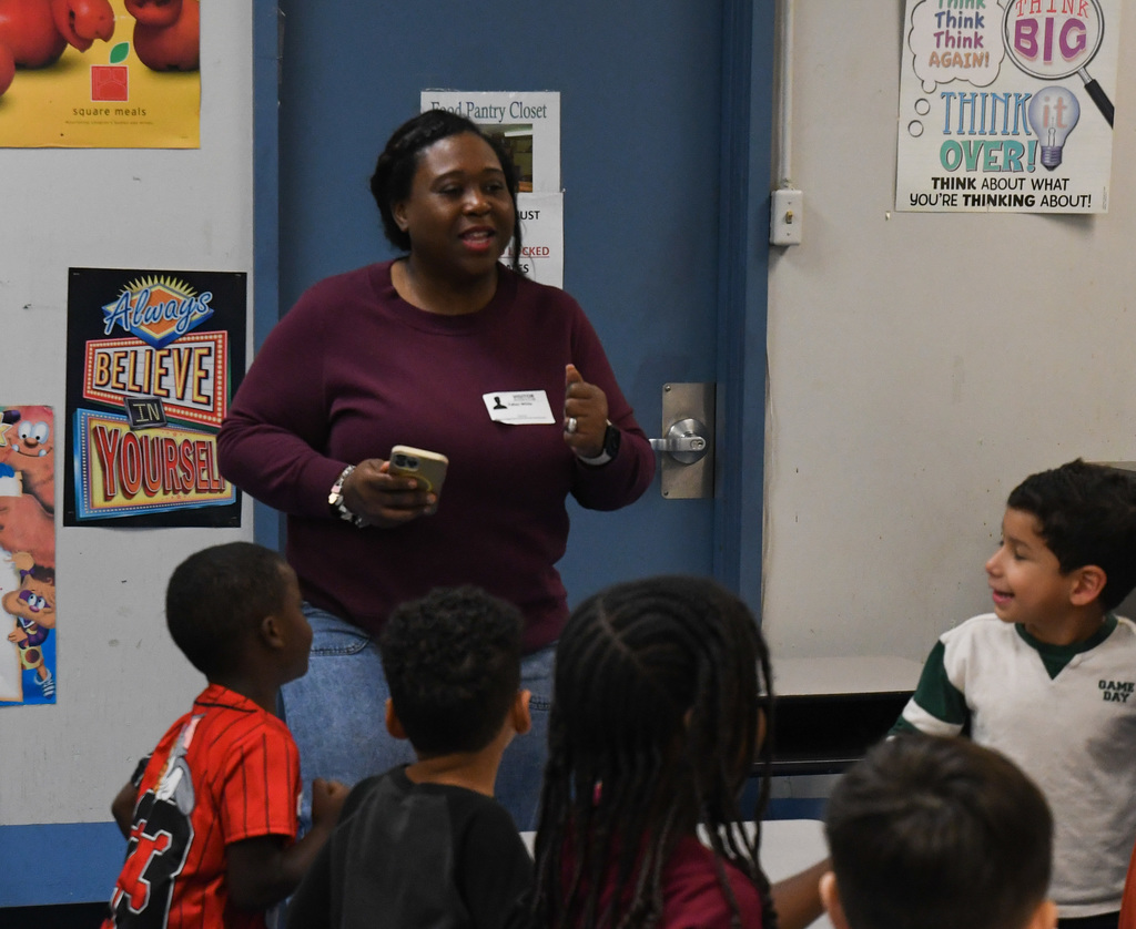 instructor interacting with children