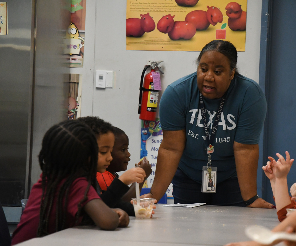 teacher interacting with students