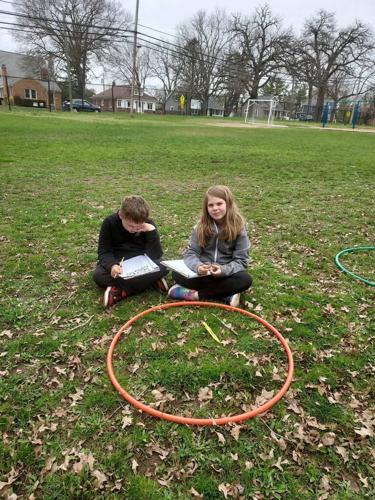 students outside looking at nature