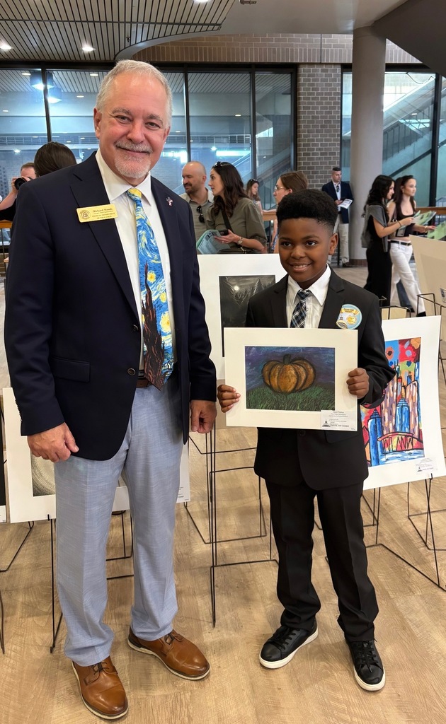 State Superintendent Richard Woods and 4th grade Pine Ridge student Noah Thomas