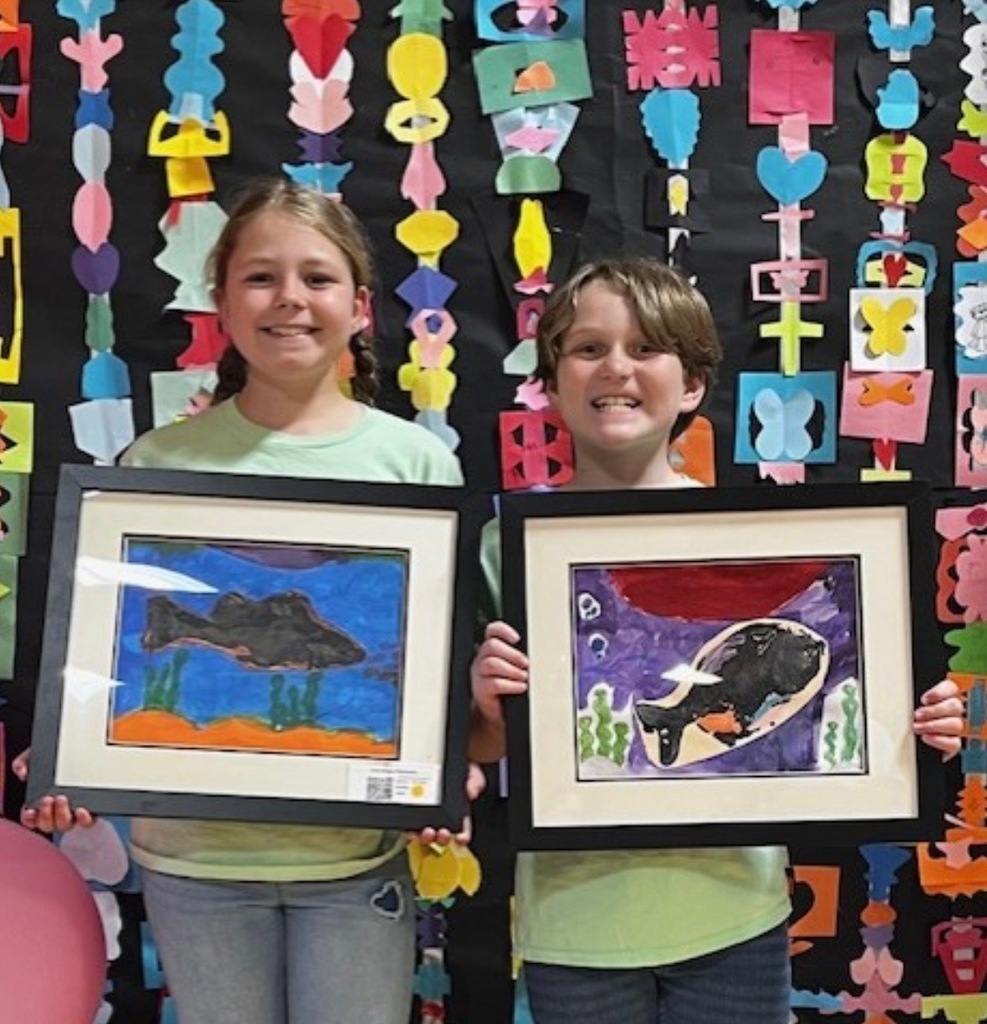 Proud artists showing off their work