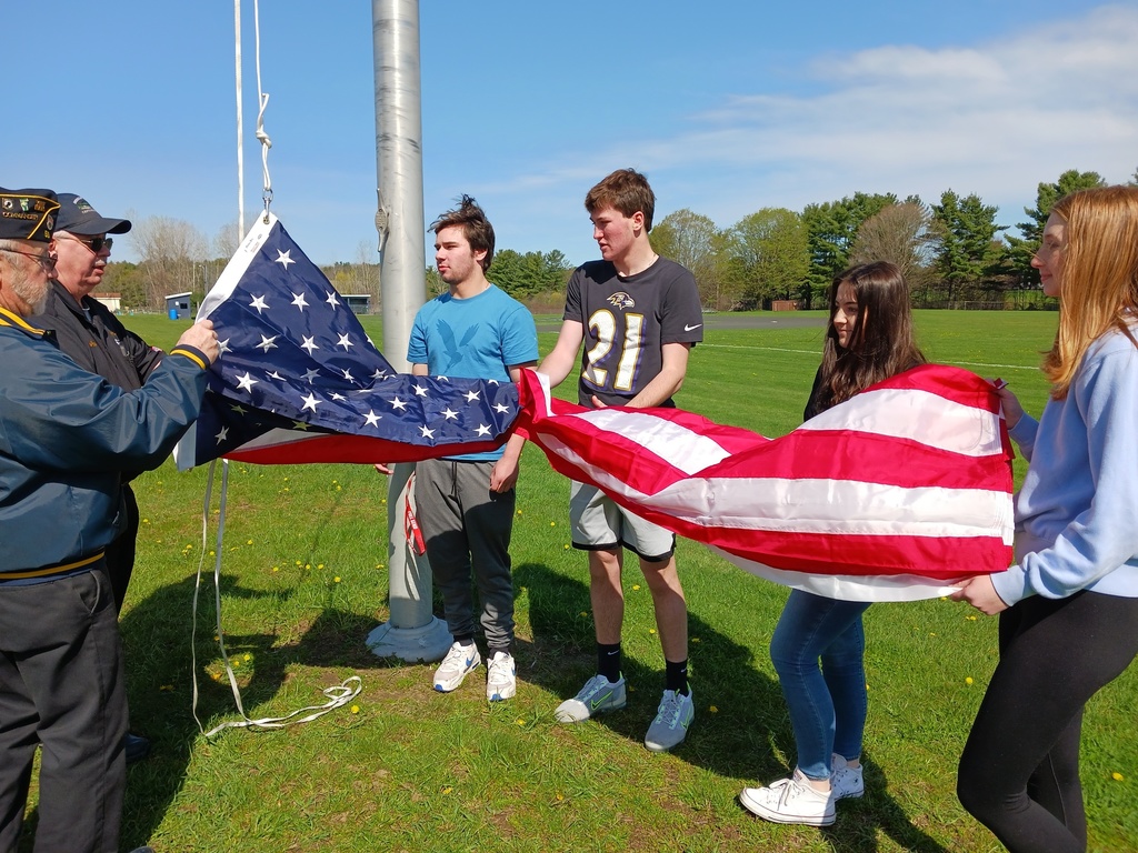 Unfolding the flag.