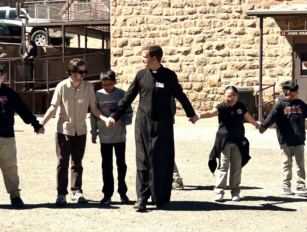 Father Gurries Playing Red Rover with Students