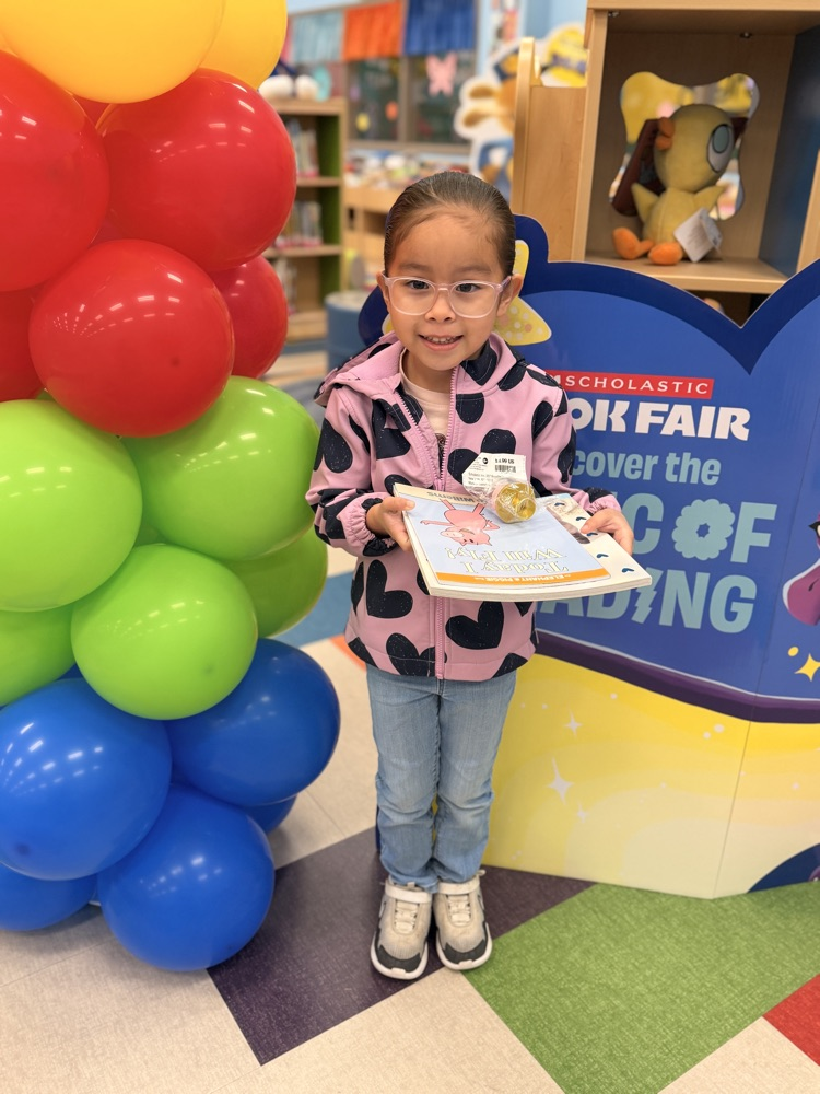 student winner with balloons 
