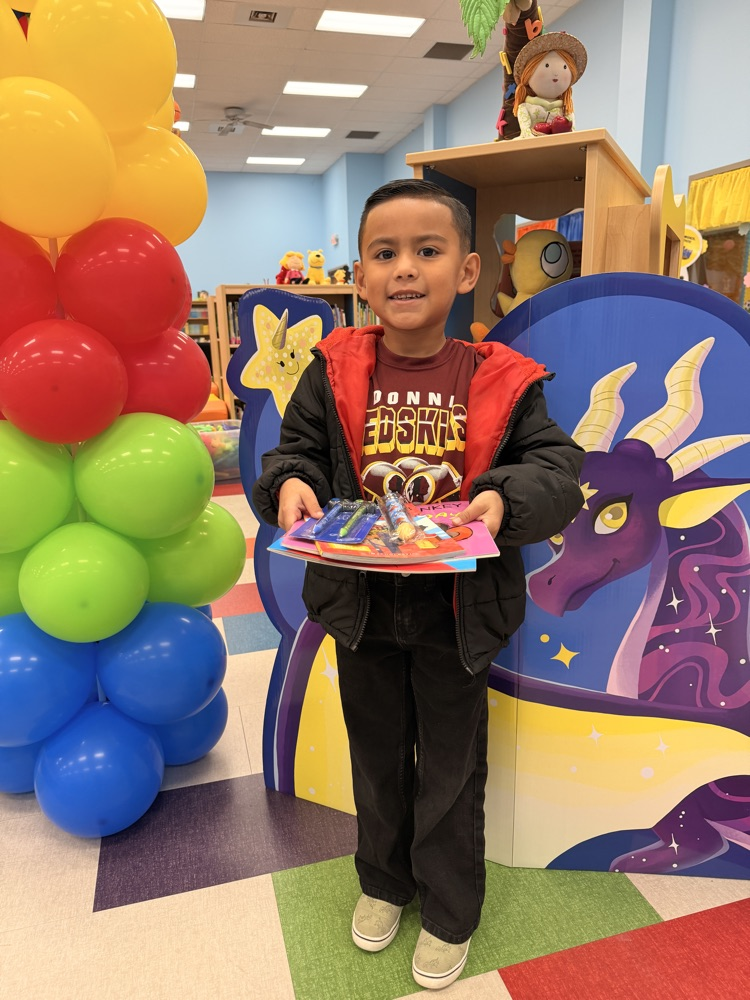 student winner with balloons 