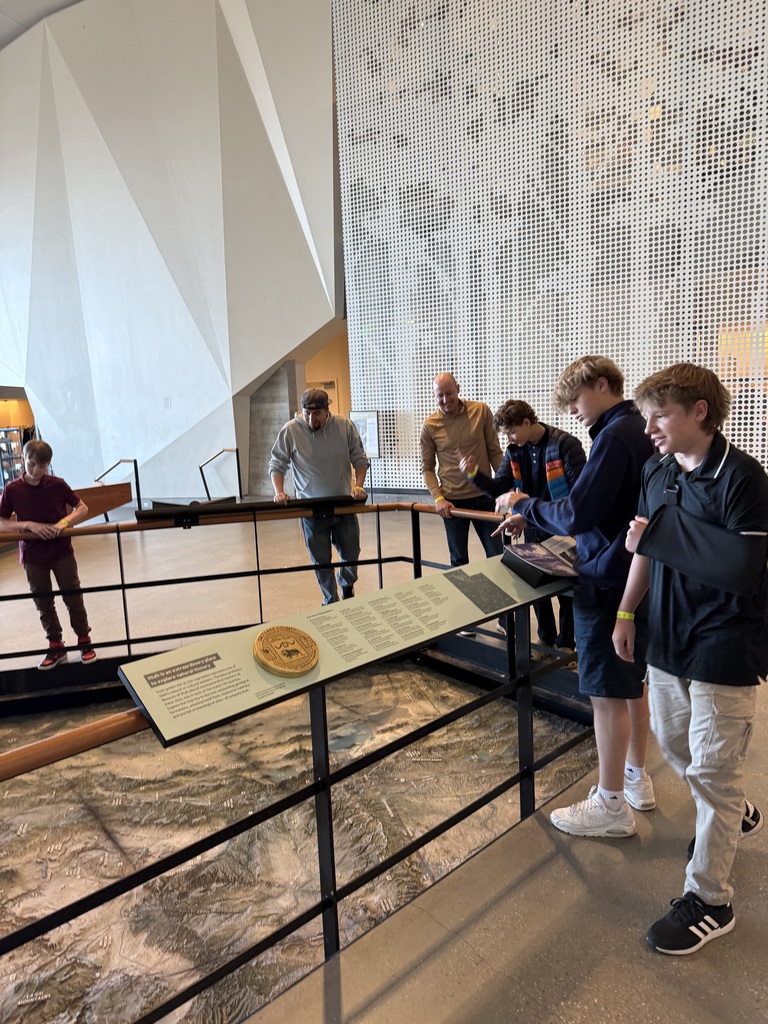 4 students viewing topography