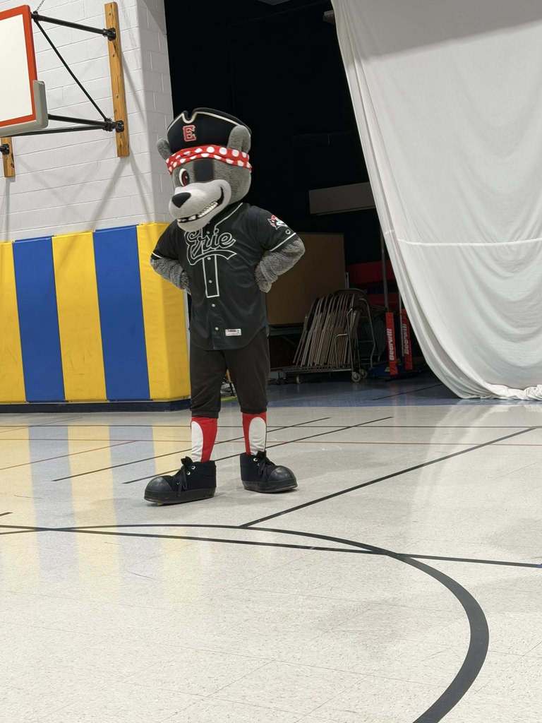 The Erie SeaWolves mascot standing on a basketball court. 