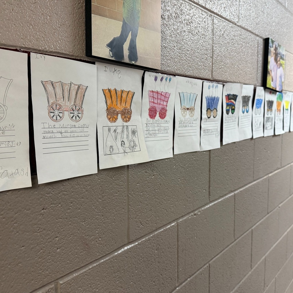 Wagons on paper colored with writing under them.