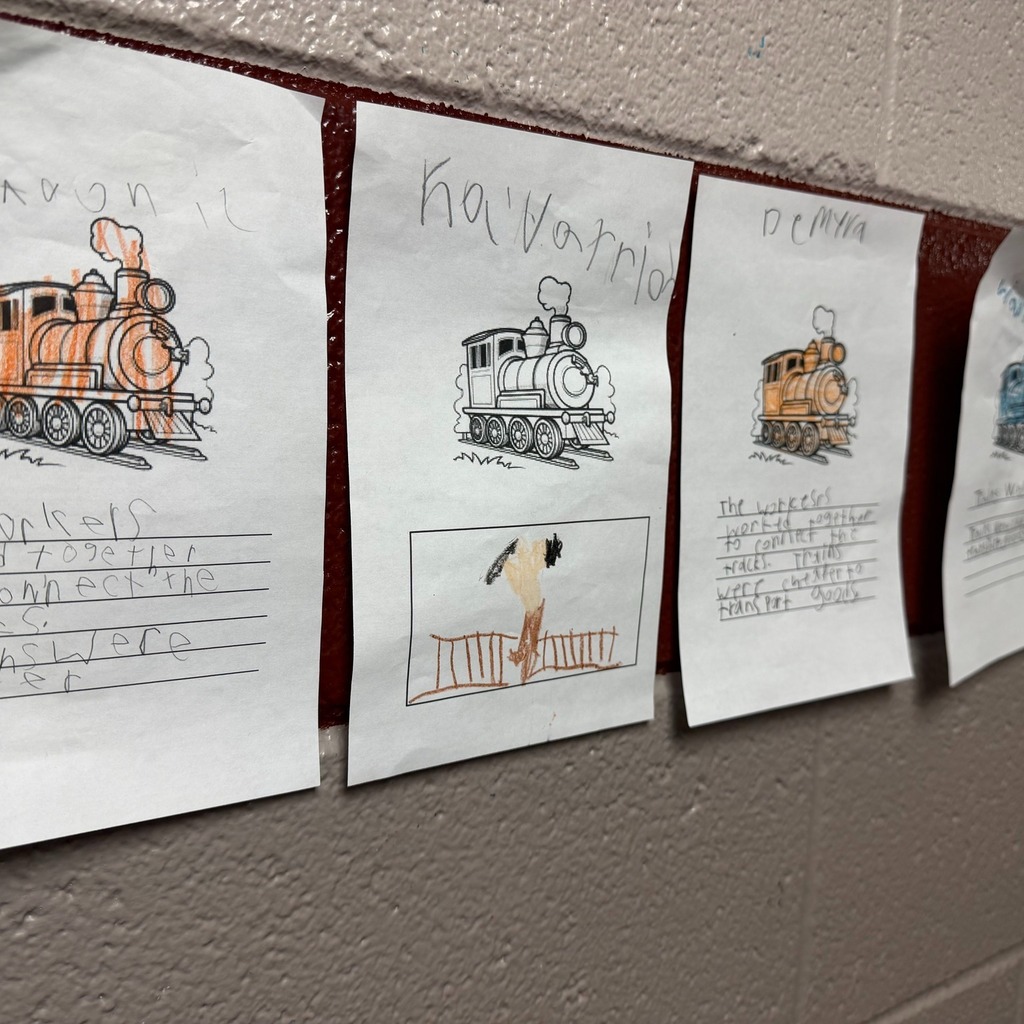 Trains on paper colored with writing under them.