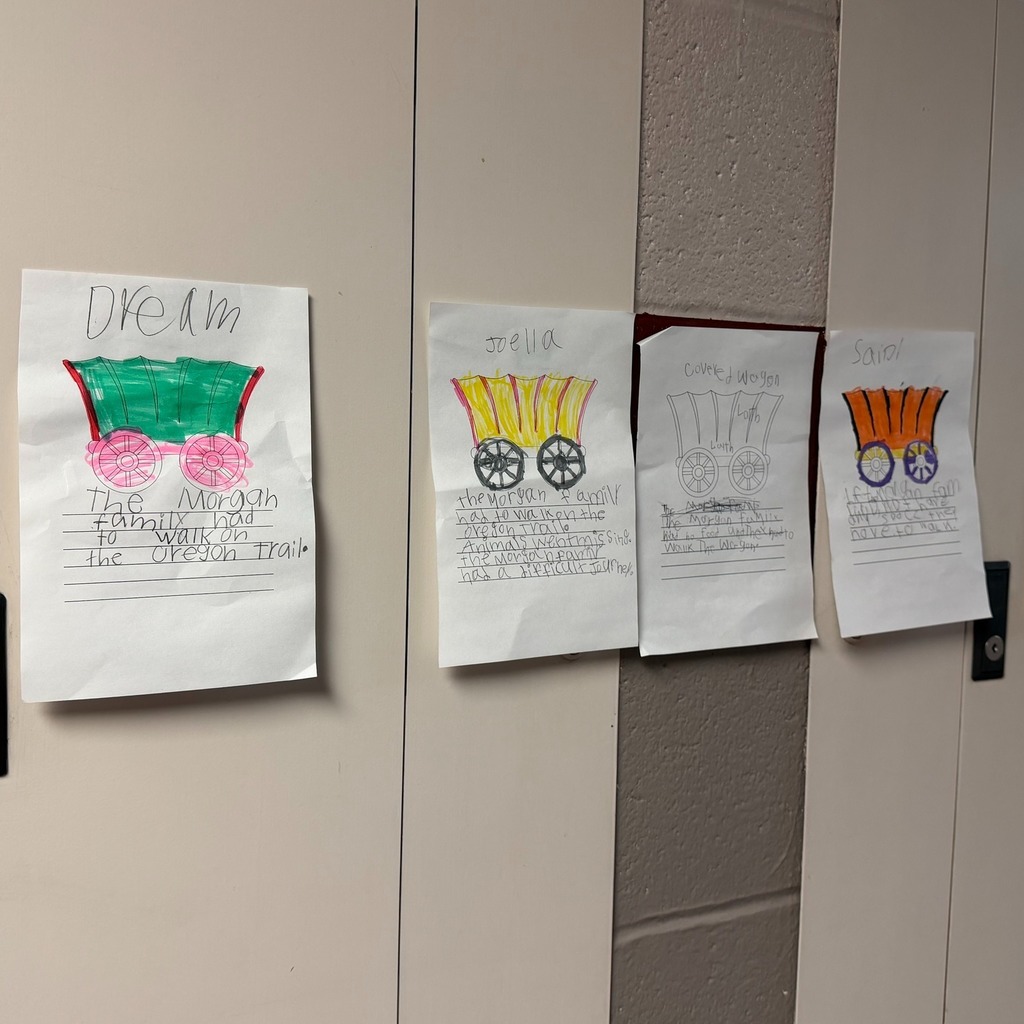 Wagons on paper colored with writing under them.