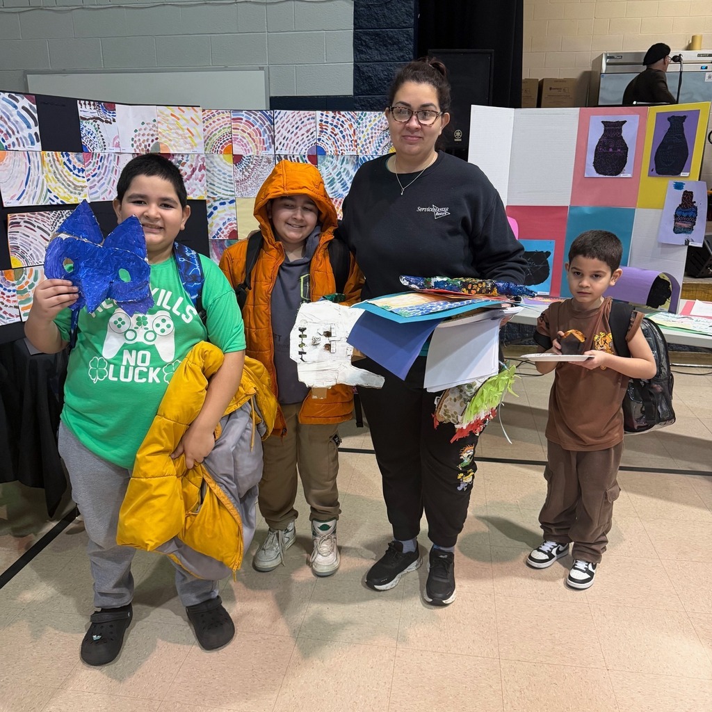 Kids and adult holding art. 