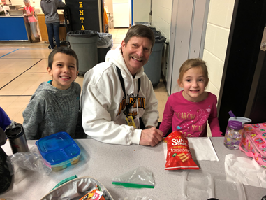 Superintendent Mark Schneider eats lunch with kids when he subbed for associate Sarah Rodgers