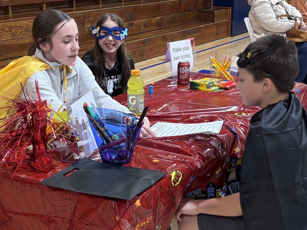 kids face painting at table with red table cloth