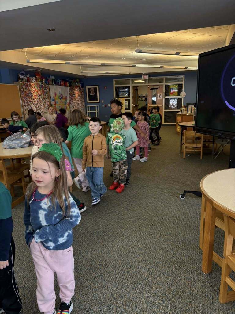 Students standing in line at the school library. 