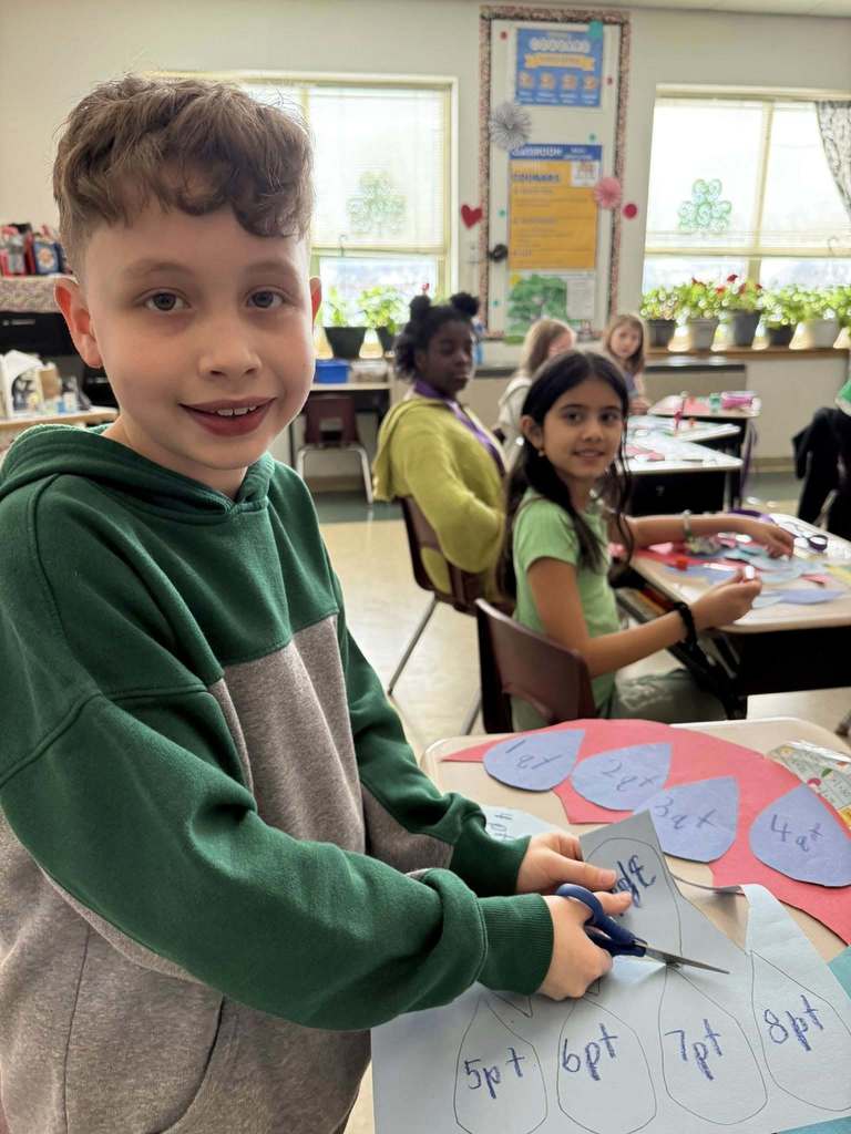 Students working on crafts in a classroom. 