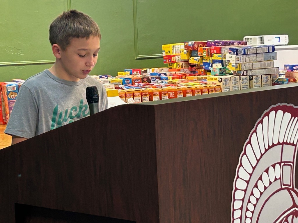 student reading his summary on famous figure