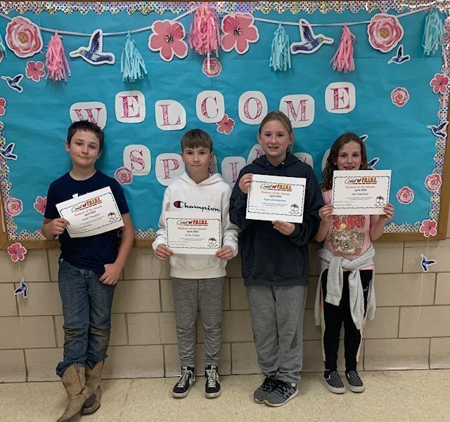 5th grade students of the month standing together with their certificate in hand