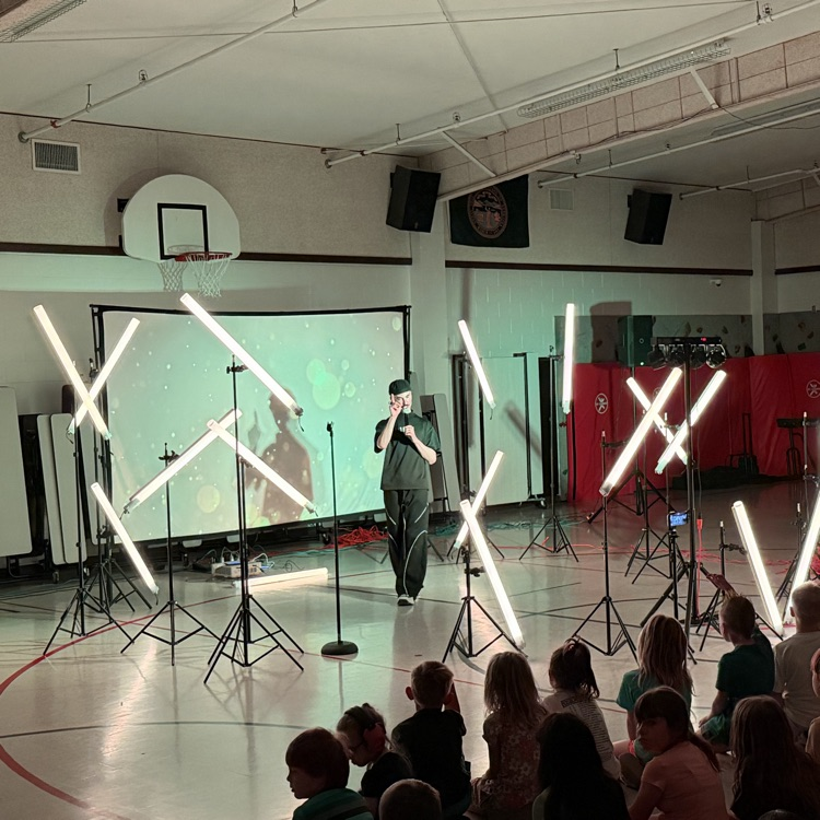 An image of Echo Dance Team sharing a positive message about perseverance with elementary students  