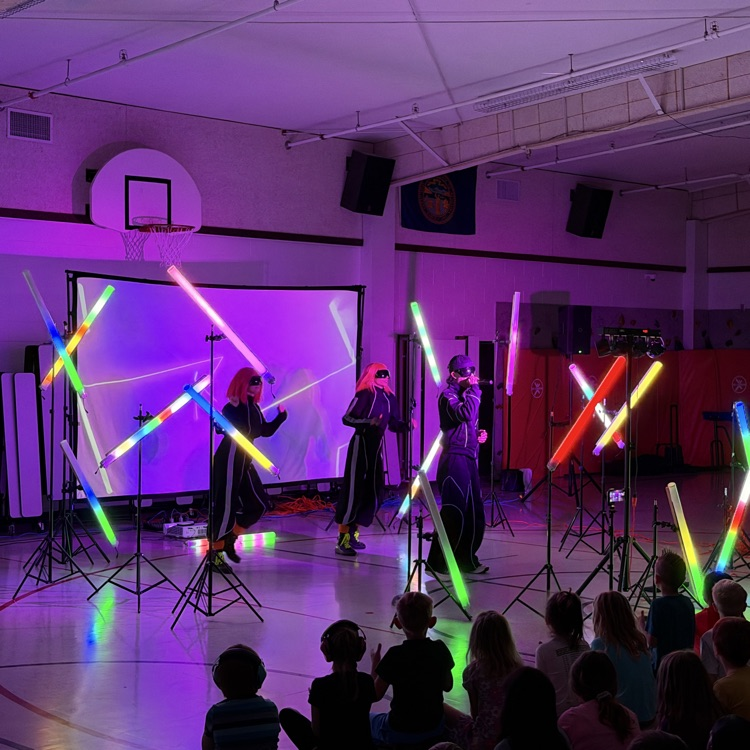 The images show the Echo Dance Team performing for the elementary students and sharing a positive message about perseverance  