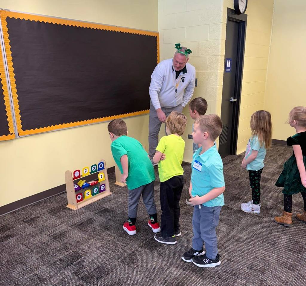 Mr. Biller engages with the preschoolers