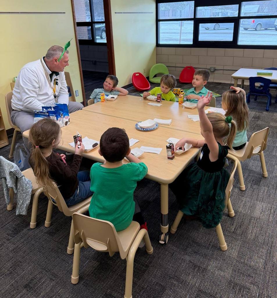 Mr. Biller visits with preschoolers.
