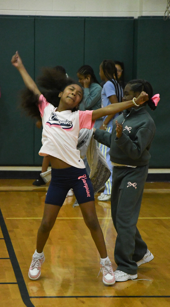a girl dancing in the school gym