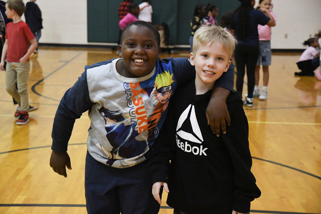 two students smiling for  photo