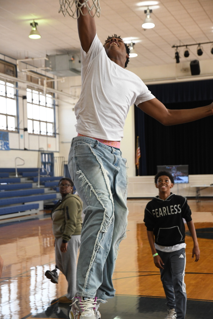 boy dunking in basketball