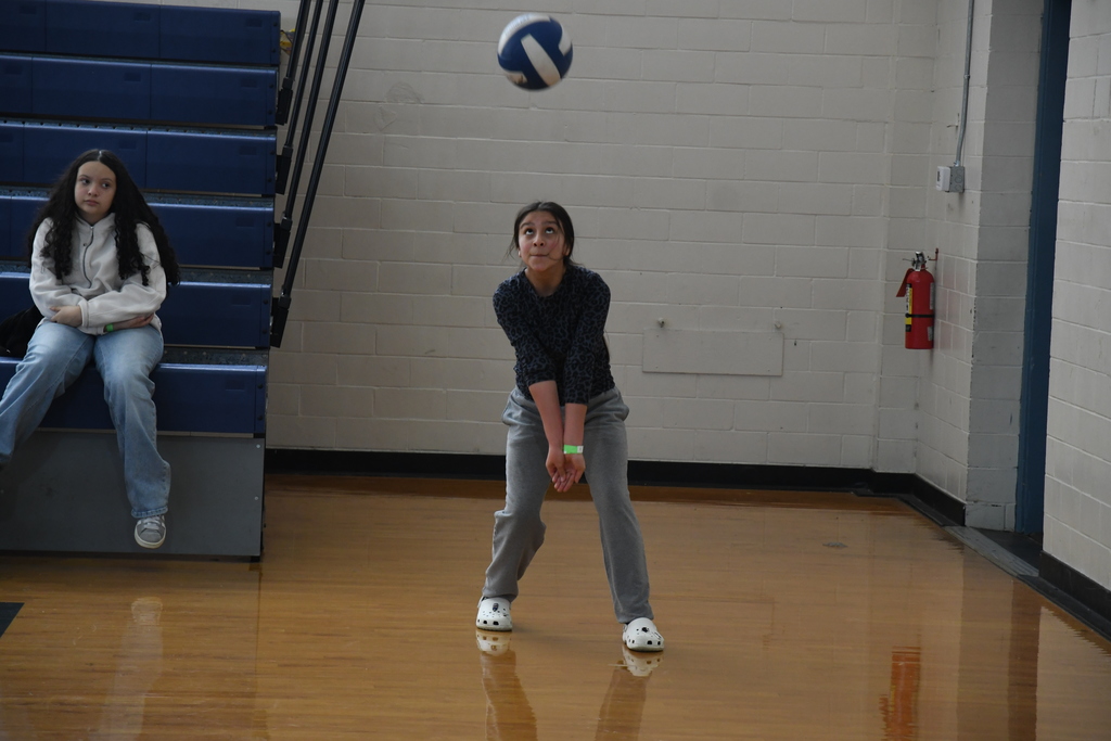 girl preparing to hit a volleyball