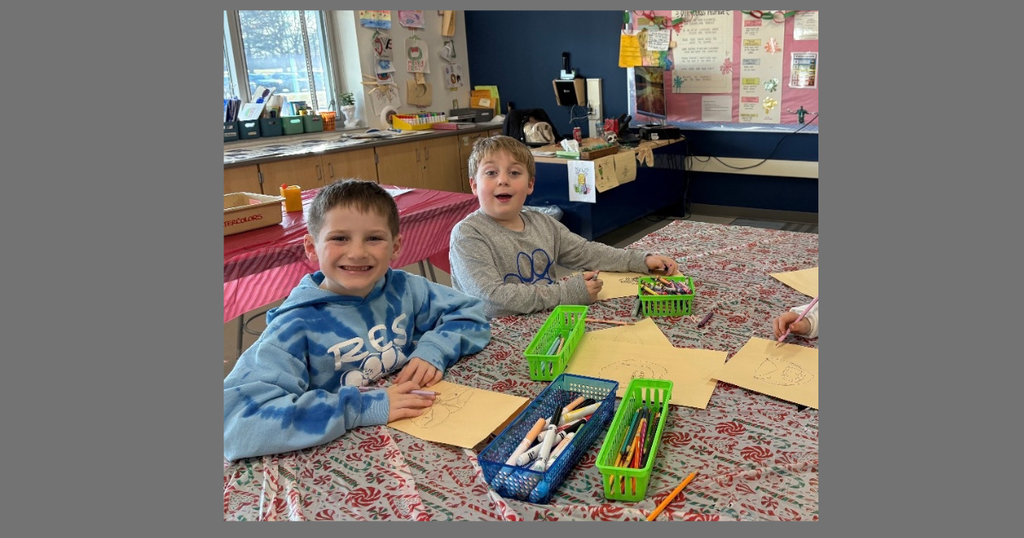 two students tracing an object