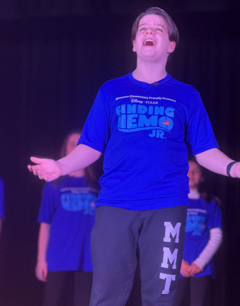 student singing in stage performance