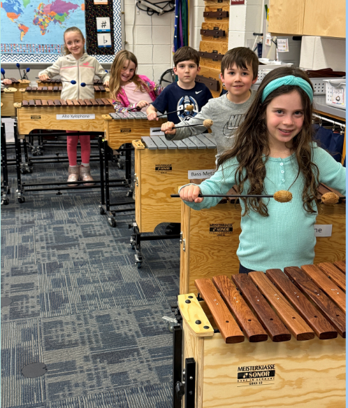 students playing the xylophone