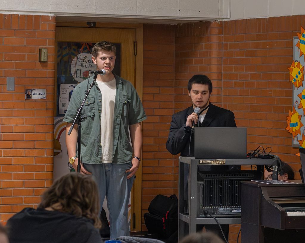 gabe staley and brayden macvenn singing at dinner theater