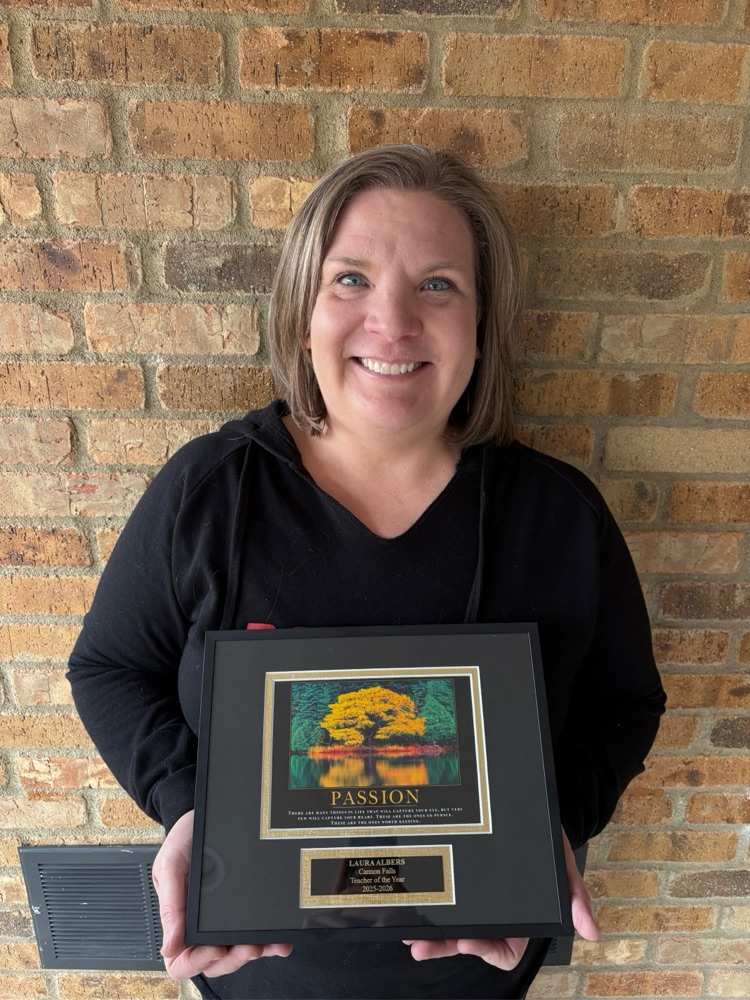 Ms. Albers pictured with award