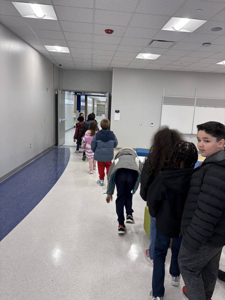 Students walking in the halls of the new Edison Elementary School. 