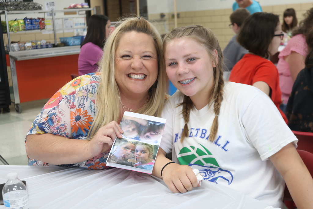 A mom and her daughter are so proud of her poetry book.