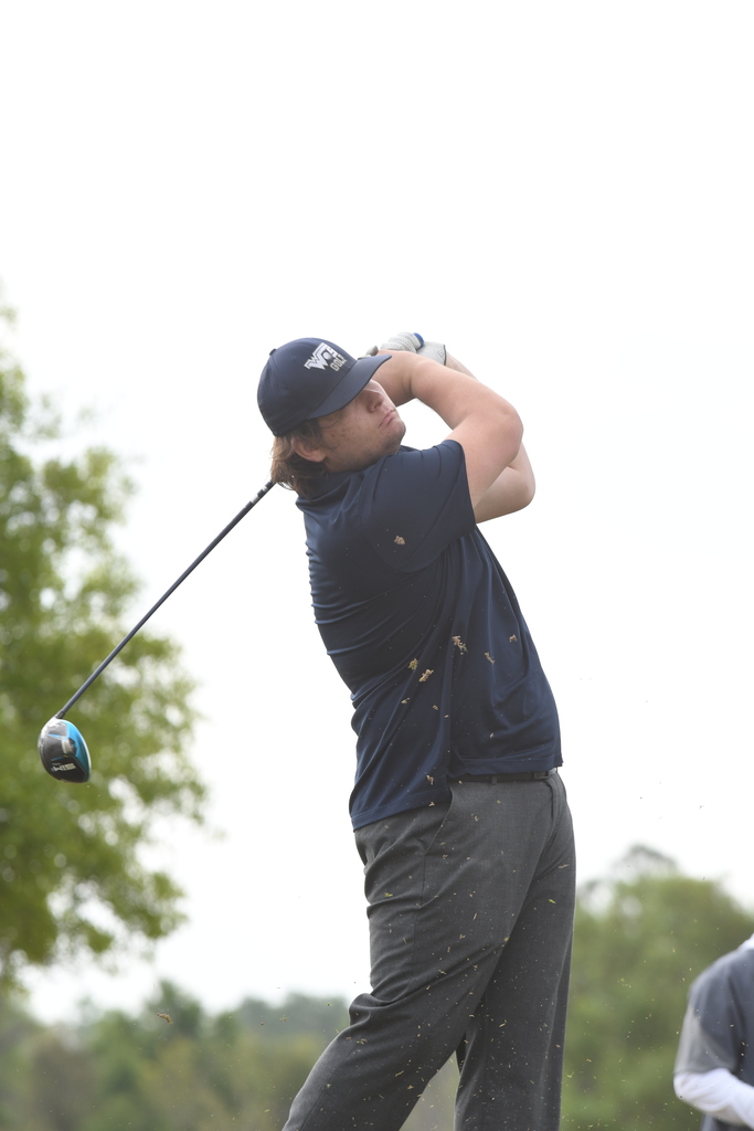 William Pugh swinging through with a golf club