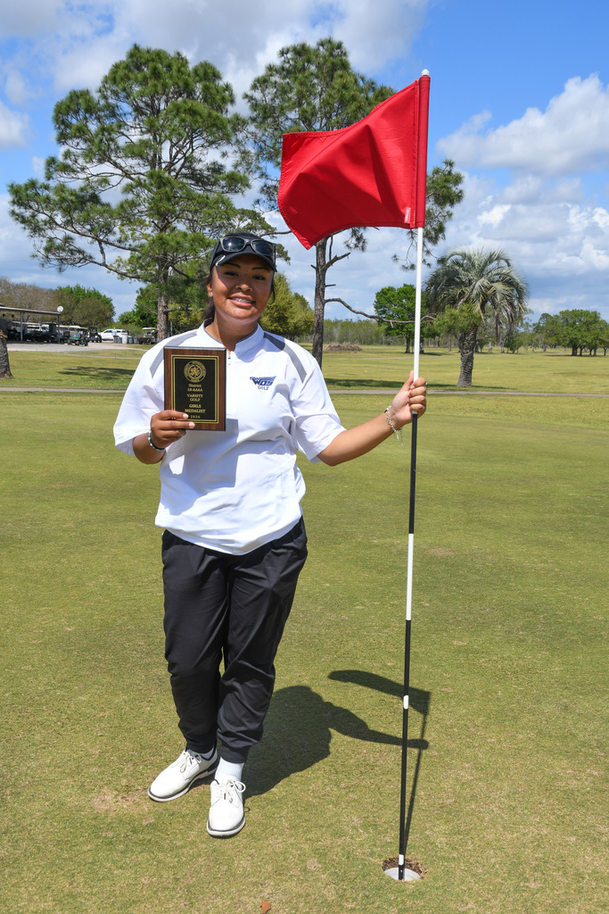 Sophia Ibarra posing with her district champion trophy