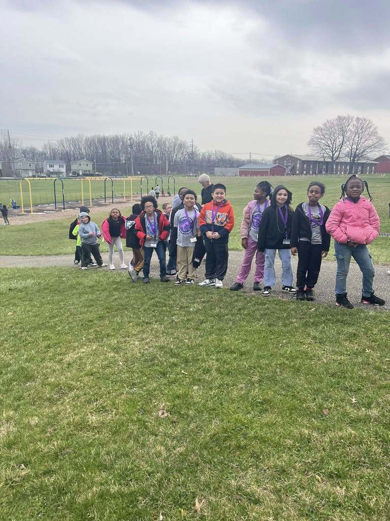 Students posing at a playground. 