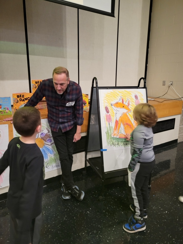 author Rick talking with students
