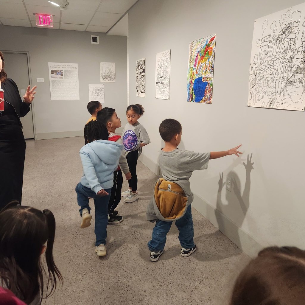 Kids looking at art in the halls at the Erie Art Museum. 
