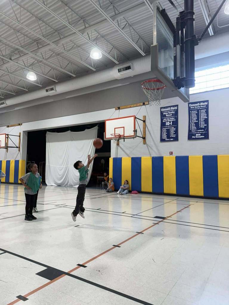 Kids playing basketball in the JoAnna Connell gym. 