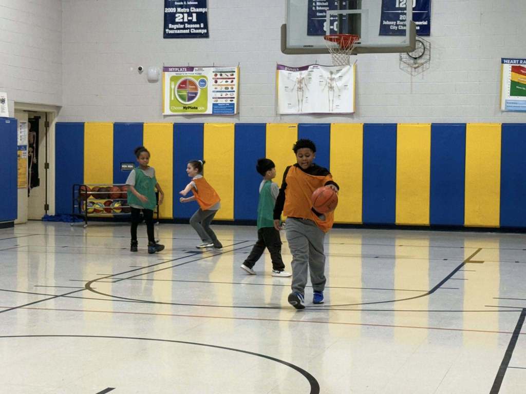 Kids playing basketball in the JoAnna Connell gym. 
