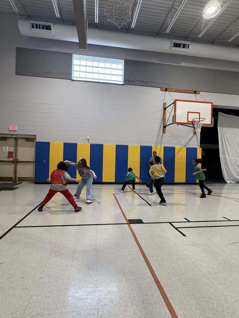 Kids playing basketball in the JoAnna Connell gym. 