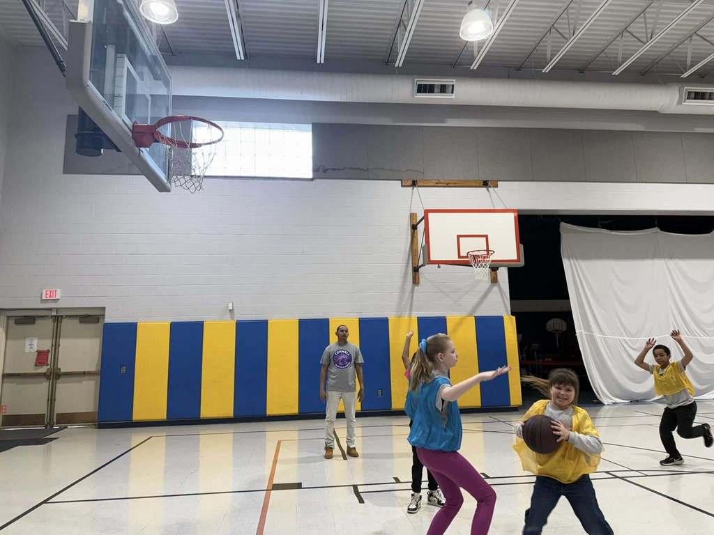 Kids playing basketball in the JoAnna Connell gym. 